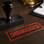 Image of a Stamp That Impressed a Bold Red Word That Reads “DISMISSED” on a Table