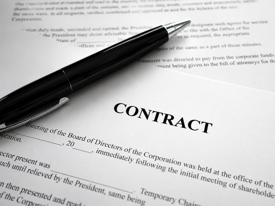 Close-Up Image of a Contract And a Pen Placed Down on Top of it